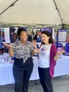 CARAD staff posing in a fundraising stall