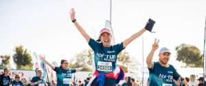 Woman celebrating finishing the HBF run
