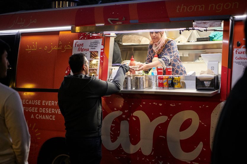 Staff serving food on Fare Go Foodtruck