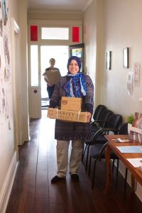 Staff carrying donation boxes